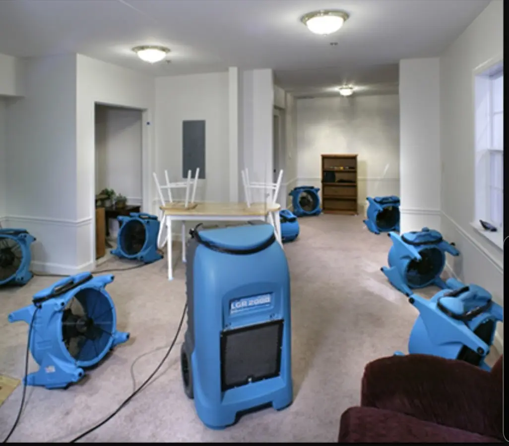 Air movers and dehumidifier setup for Water Damage Restoration in Williams